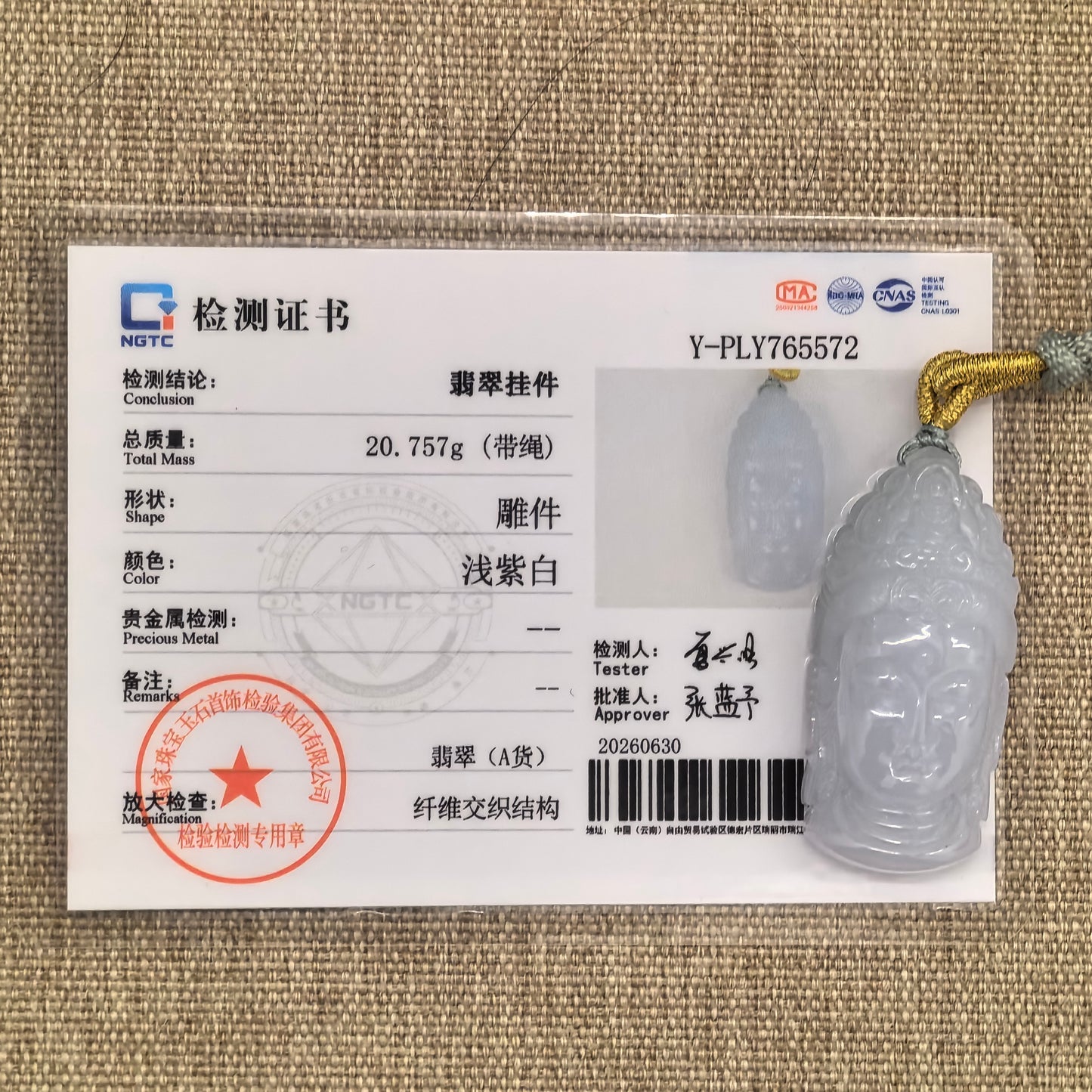 NGTC certified pale lavender Buddha head jadeite pendant shown with matching certificate.