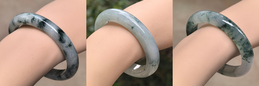Three jadeite bangles shown side by side to compare texture and translucency