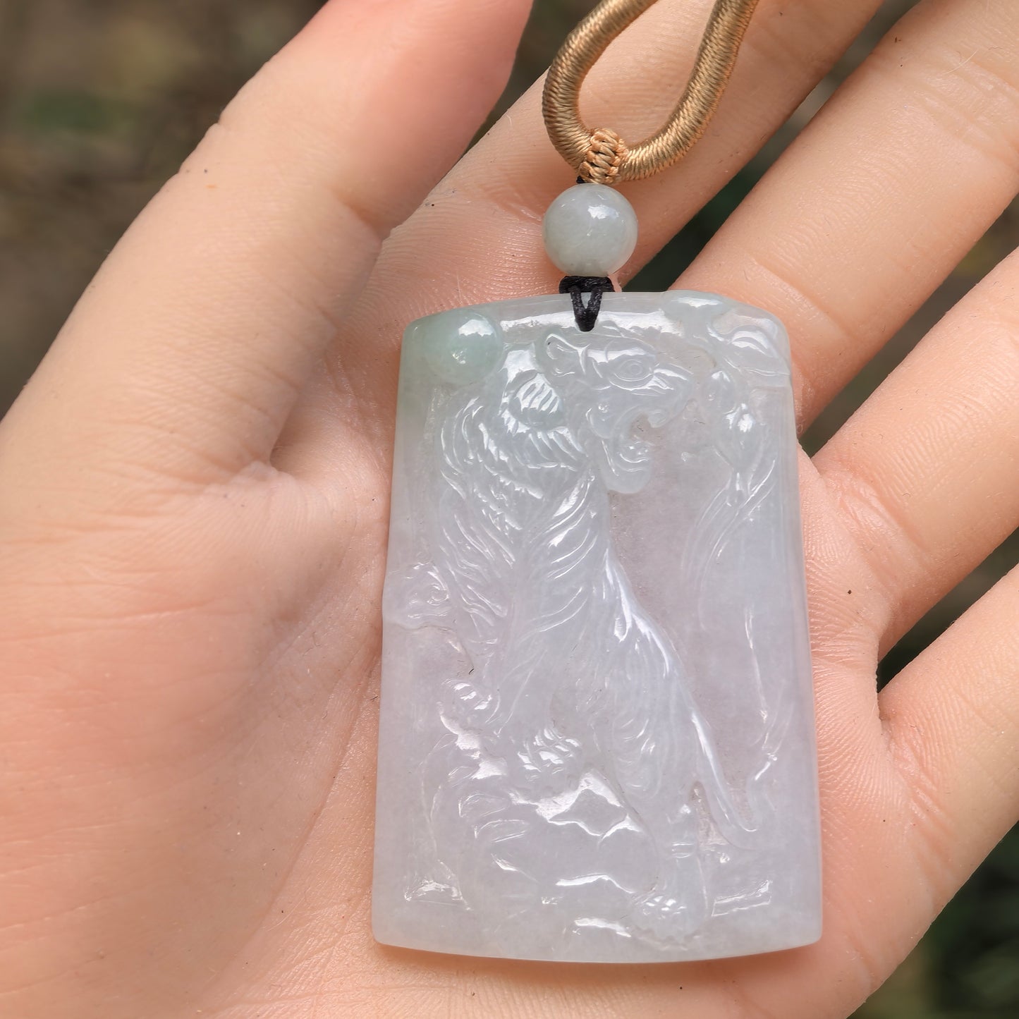 Natural Grade-A Jadeite Glutinous Icy Tiger Plaque Pendant with a Hint of Green · Burmese Jade