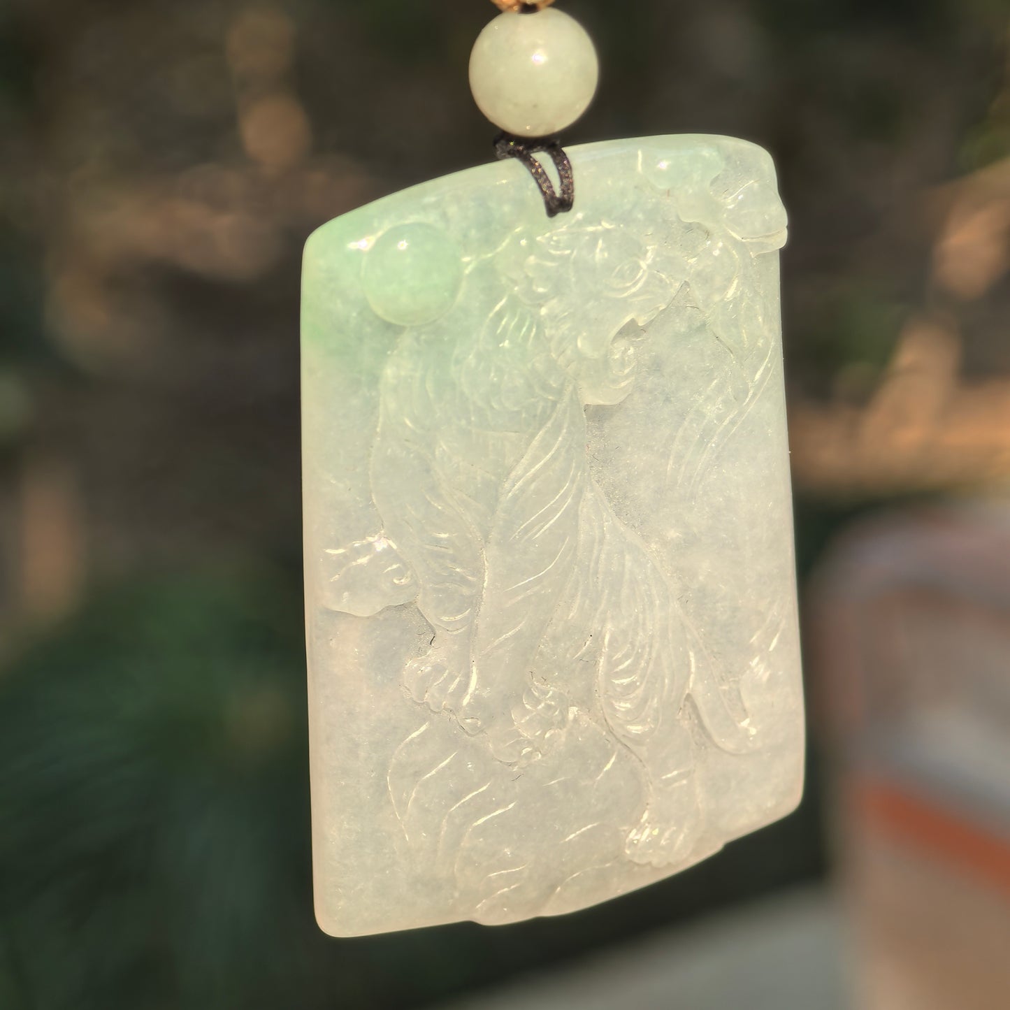 Natural Grade-A Jadeite Glutinous Icy Tiger Plaque Pendant with a Hint of Green · Burmese Jade