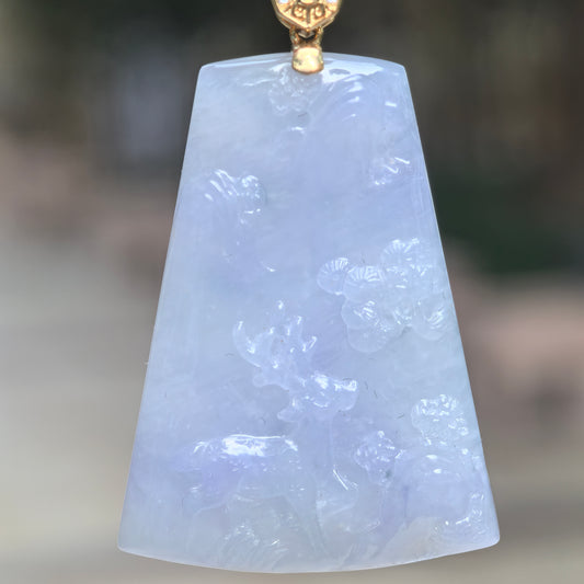 Close-up of purple deer plaque jadeite pendant showing delicate deer and floral carving.
