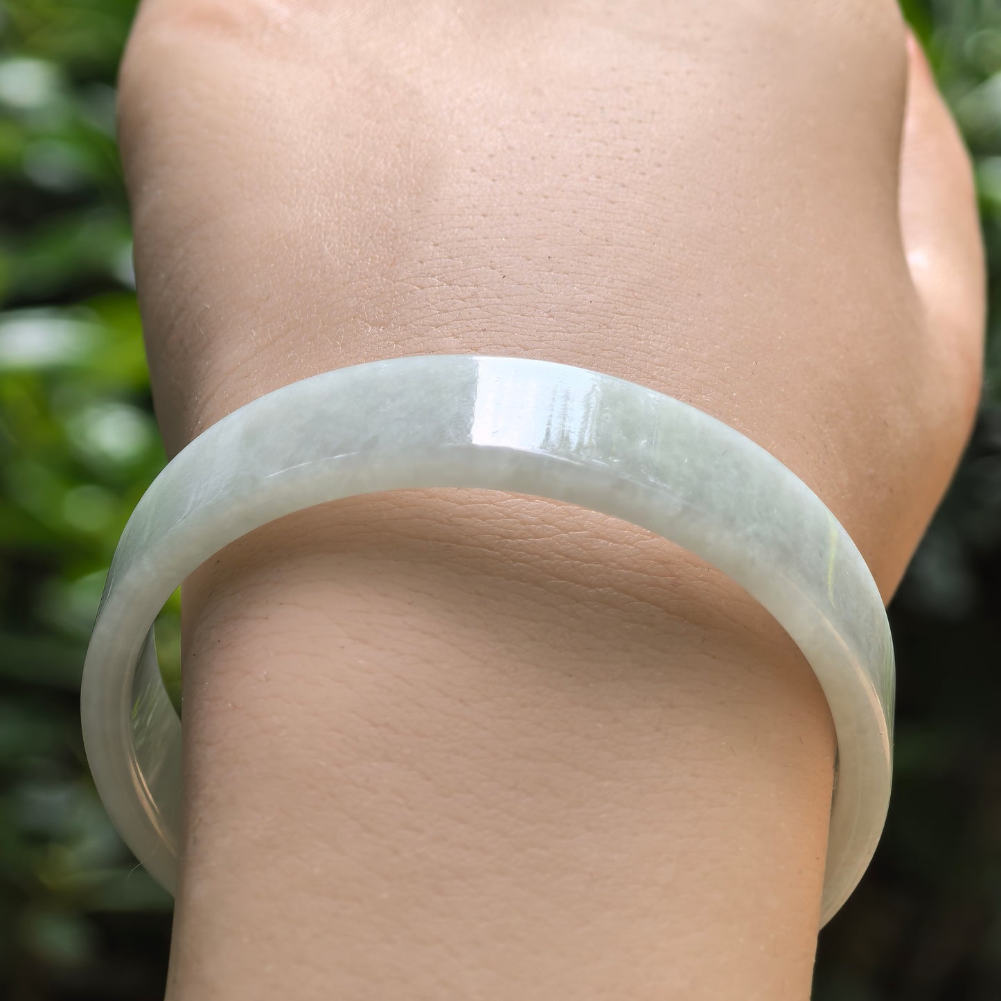 Natural jadeite bangle worn on wrist