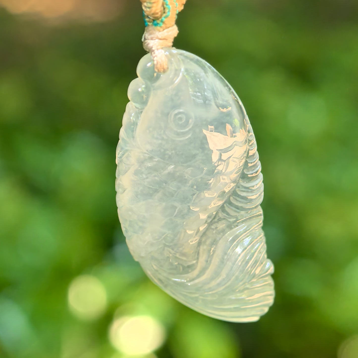 Natural Grade-A icy translucent pale green fish jadeite pendant front view
