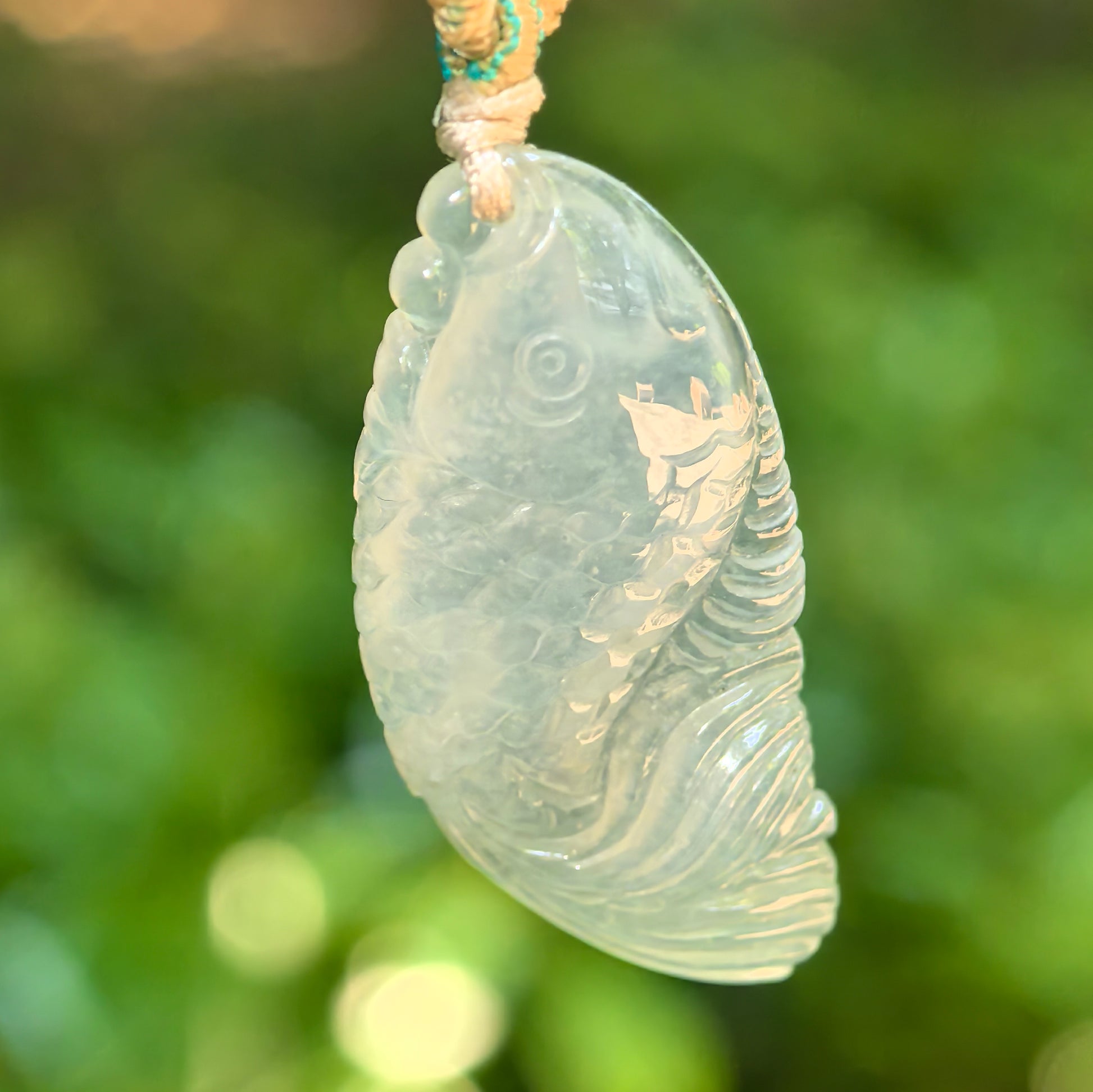 Natural Grade-A icy translucent pale green fish jadeite pendant front view
