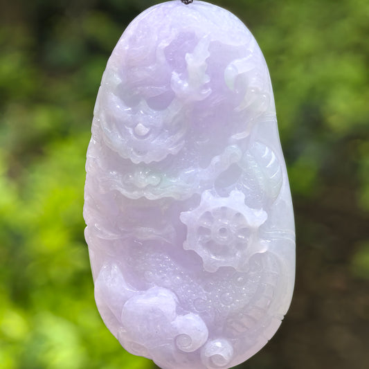 Natural Grade-A glutinous light purple jadeite dragon pendant shown from the front in natural light.