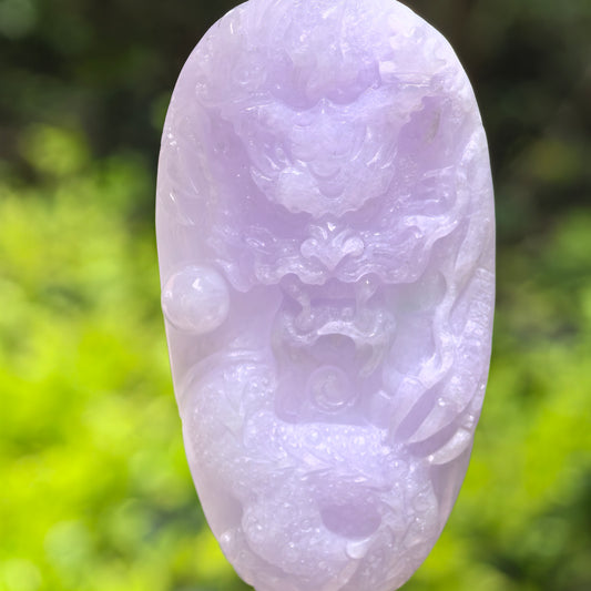 Natural Grade-A glutinous light purple jadeite dragon pendant shown from the front in natural light.