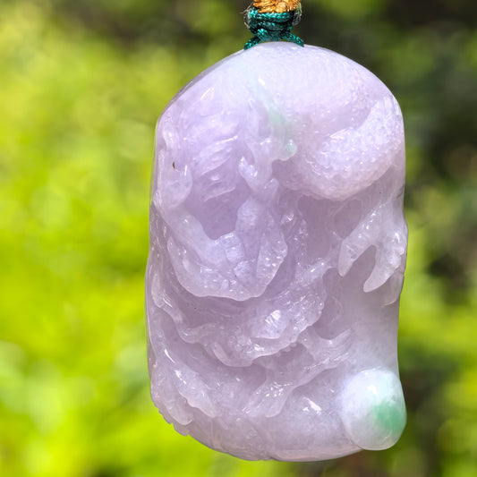 Natural Grade-A glutinous light purple jadeite dragon pendant with pale green accent shown from the front.