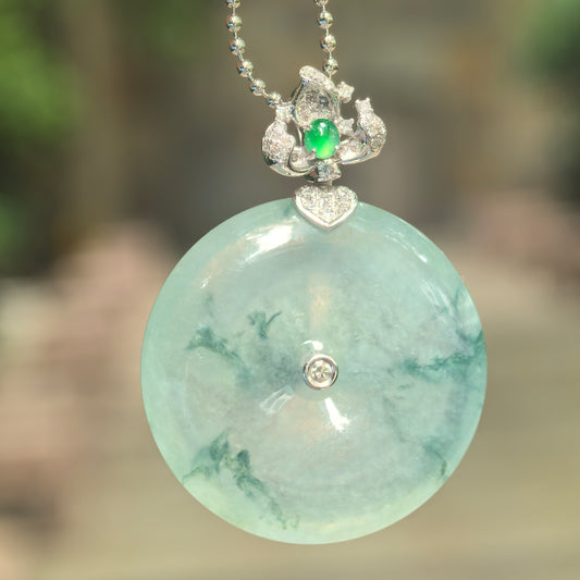 Natural Grade-A icy glutinous floating green Peace Pendant jadeite pendant with 18K gold and diamond accents.
