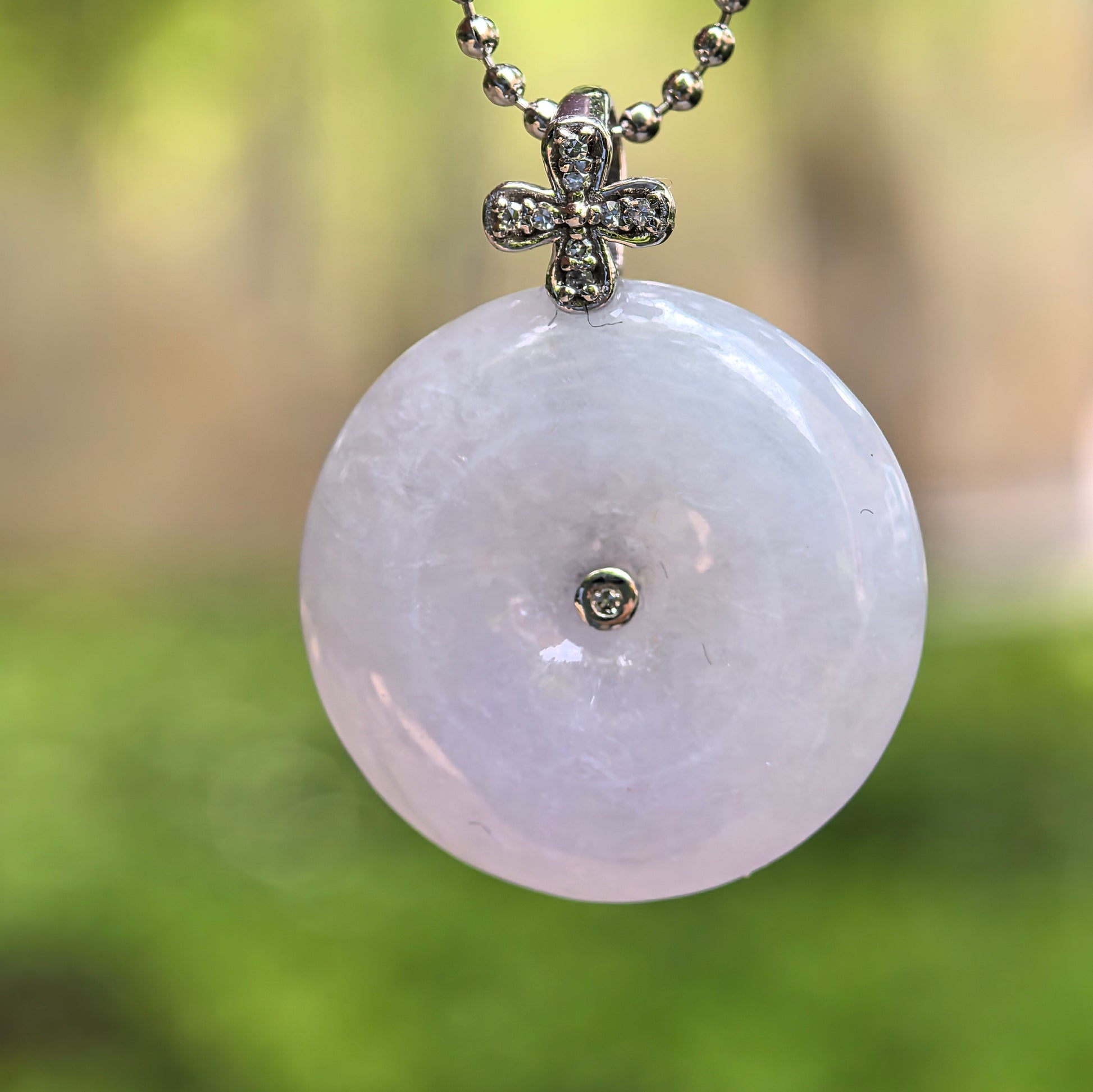 Natural Grade-A glutinous light lavender Peace Pendant jadeite pendant with 18K gold diamond setting.