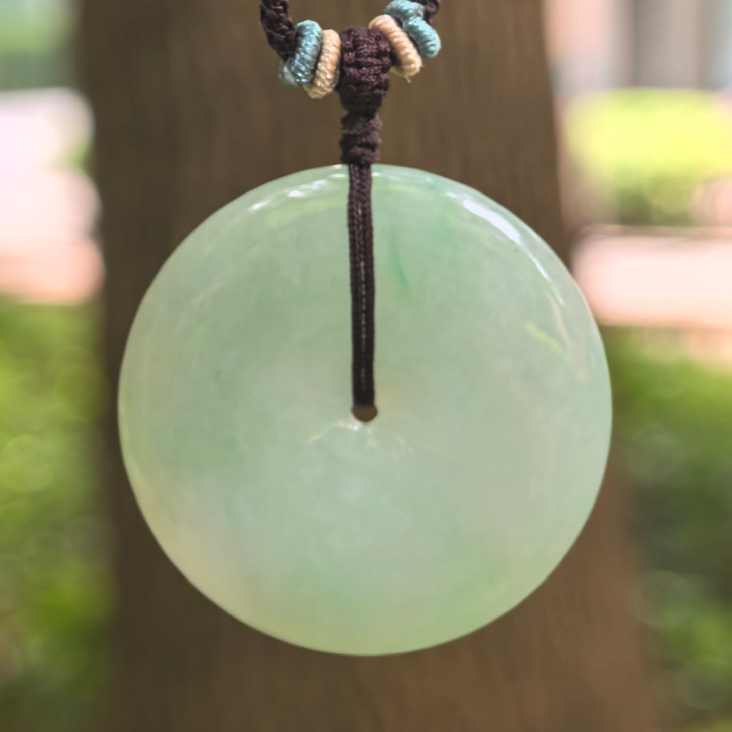 Natural Grade-A glutinous light green Peace Pendant jadeite pendant hanging on cord.

