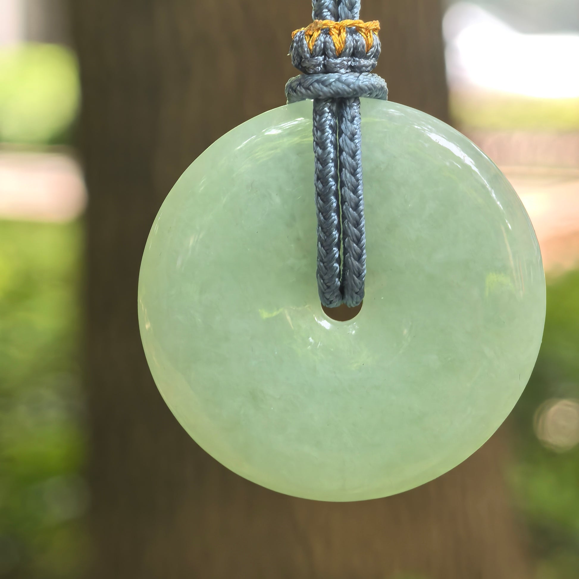 Natural Grade-A glutinous pale green Peace Pendant jadeite pendant hanging on cord.
