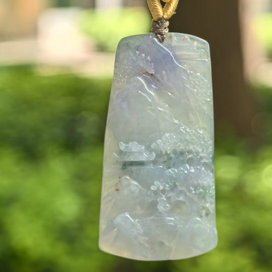 Natural Grade-A icy glutinous purple landscape plaque jadeite pendant hanging on a handwoven cord.
