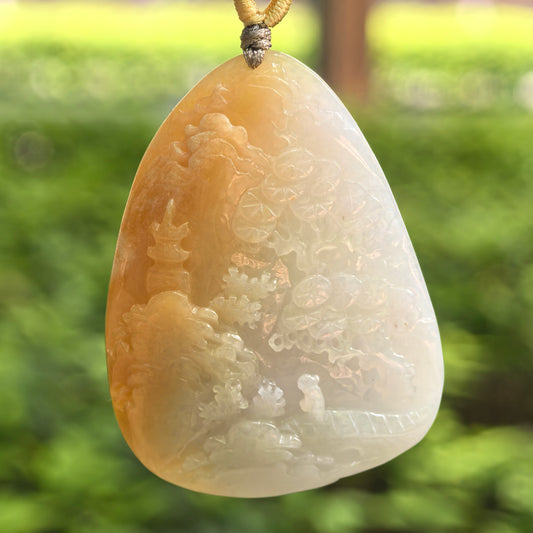 Natural Grade-A glutinous yellow-white landscape jadeite pendant hanging on cord with honey-yellow color zoning.
