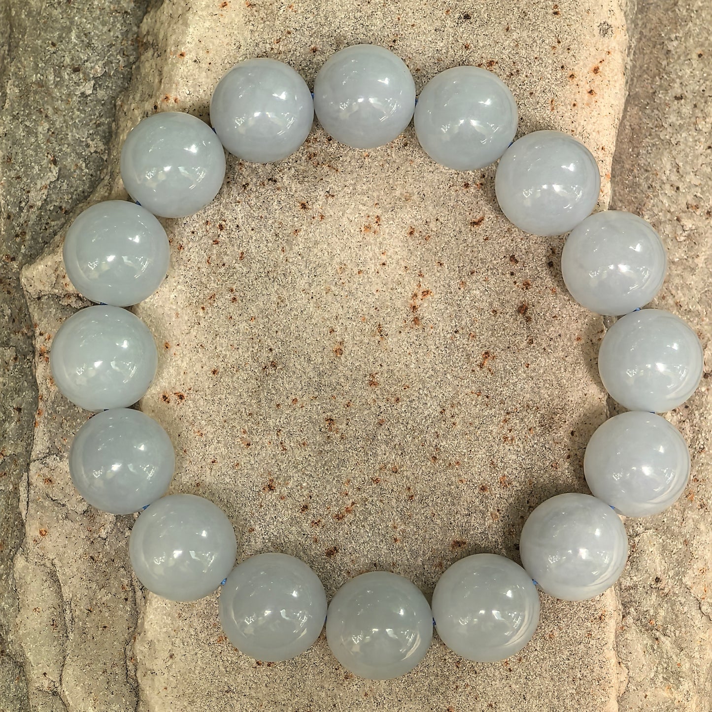 NGTC certified natural Burmese jadeite bracelet arranged in a circle with 16 round beads.
