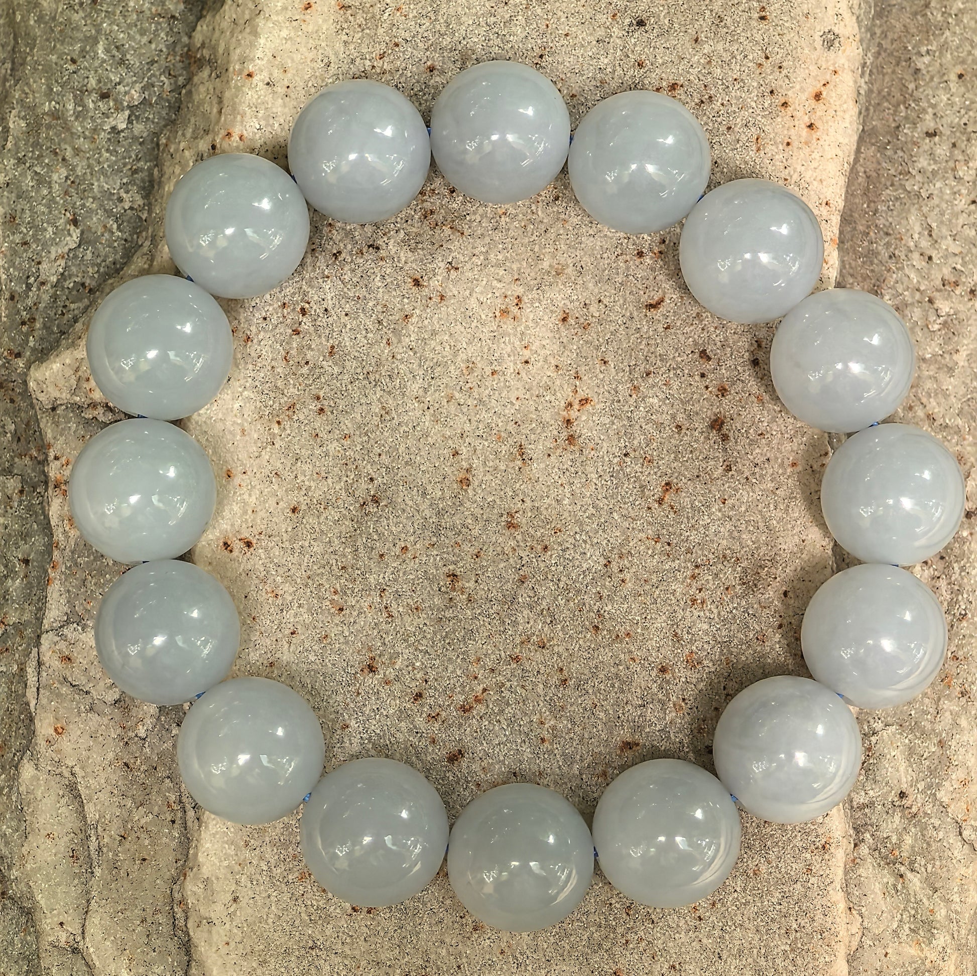 NGTC certified natural Burmese jadeite bracelet arranged in a circle with 16 round beads.
