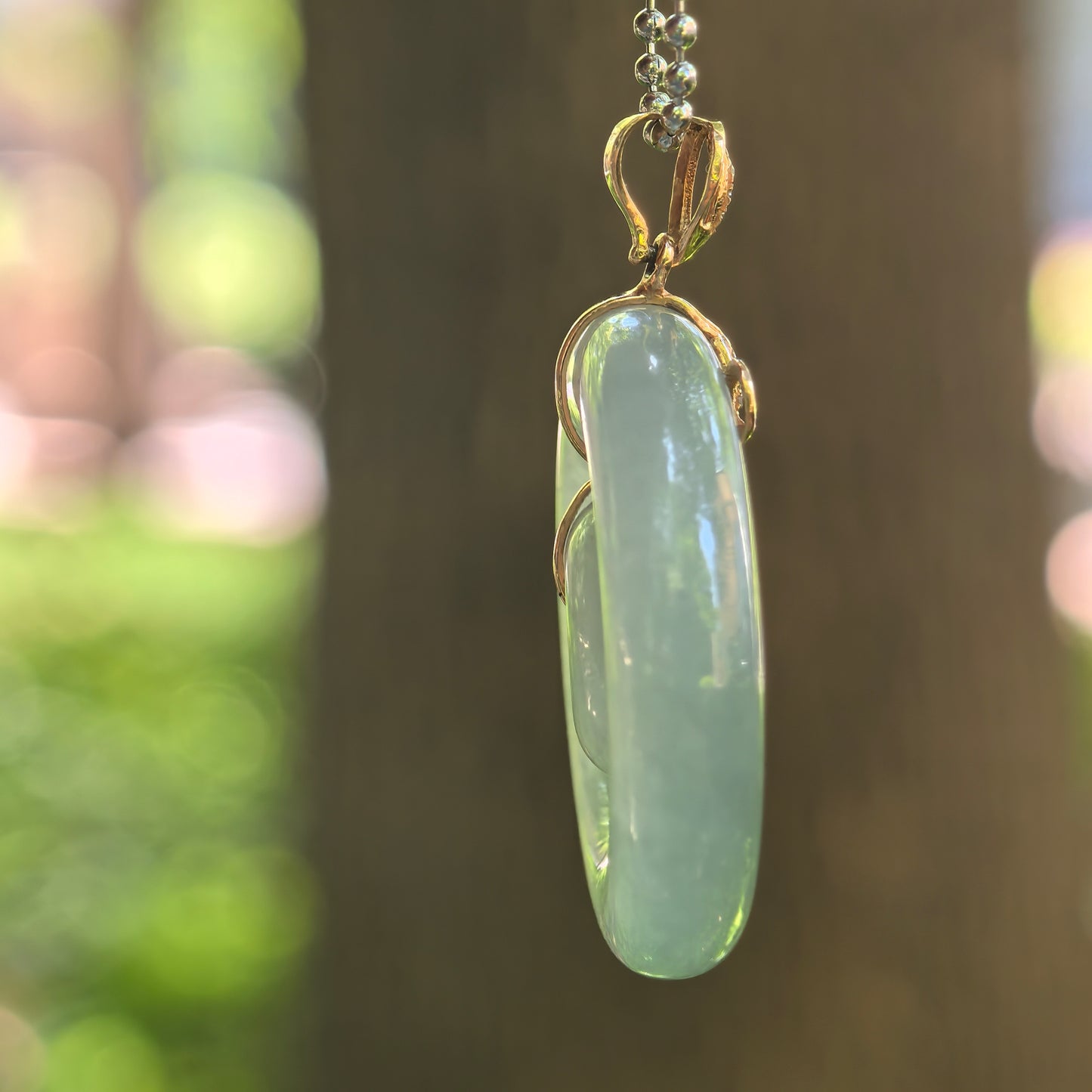 Natural Grade-A Jadeite Icy Glutinous Lake Green Interlocking Donut Pendant · Burmese Jade