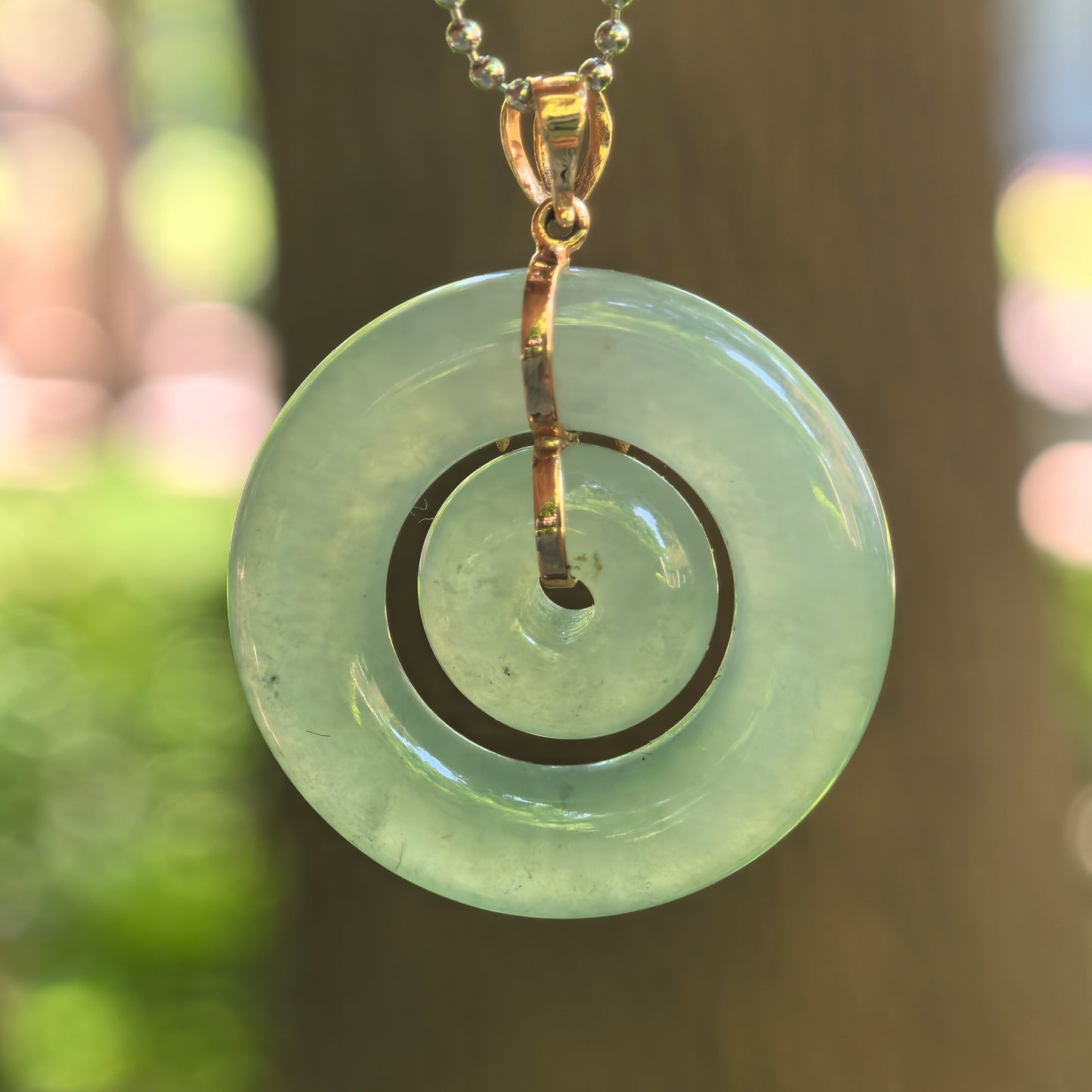 Natural Grade-A Jadeite Icy Glutinous Lake Green Interlocking Donut Pendant · Burmese Jade