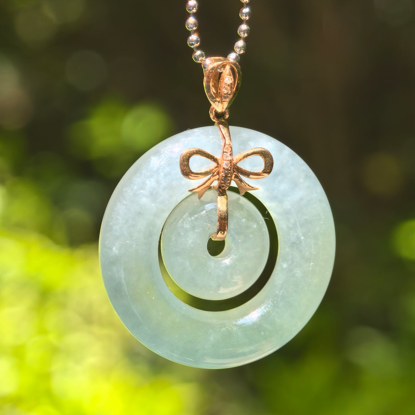 Natural Grade-A Jadeite Icy Glutinous Lake Green Interlocking Donut Pendant · Burmese Jade