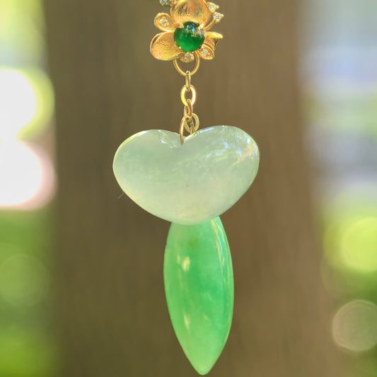 Natural Grade-A glutinous icy white and green jadeite pendant hanging with 18K gold floral connector.