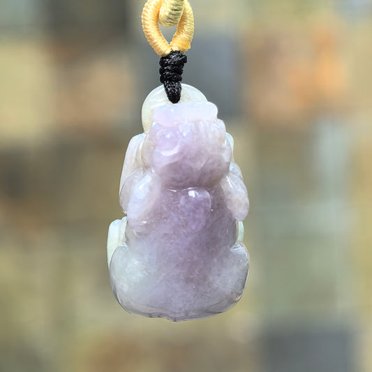 Back view of glutinous lavender Pixiu jadeite pendant showing pale green areas and natural texture.
