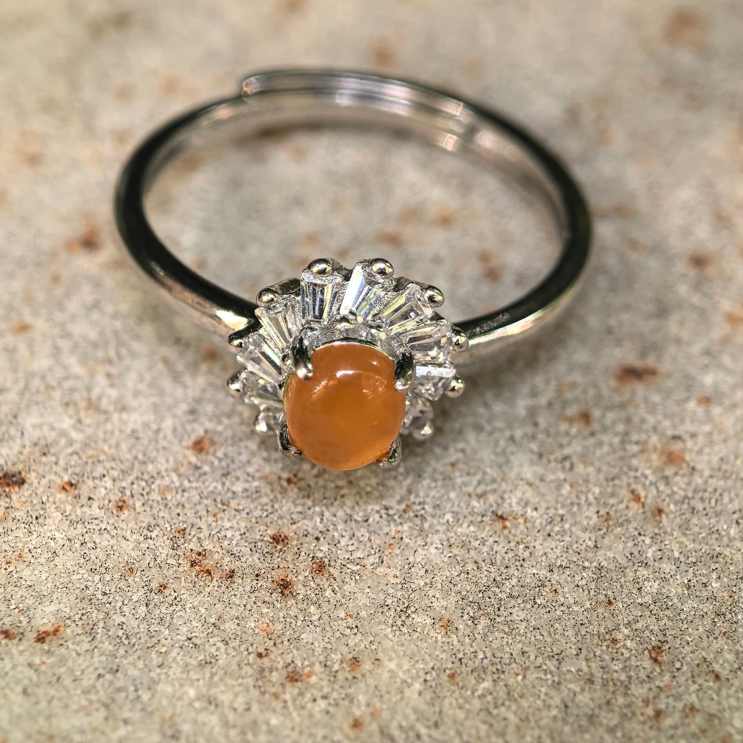 NGTC certified yellow jadeite silver ring with fan-shaped halo setting.