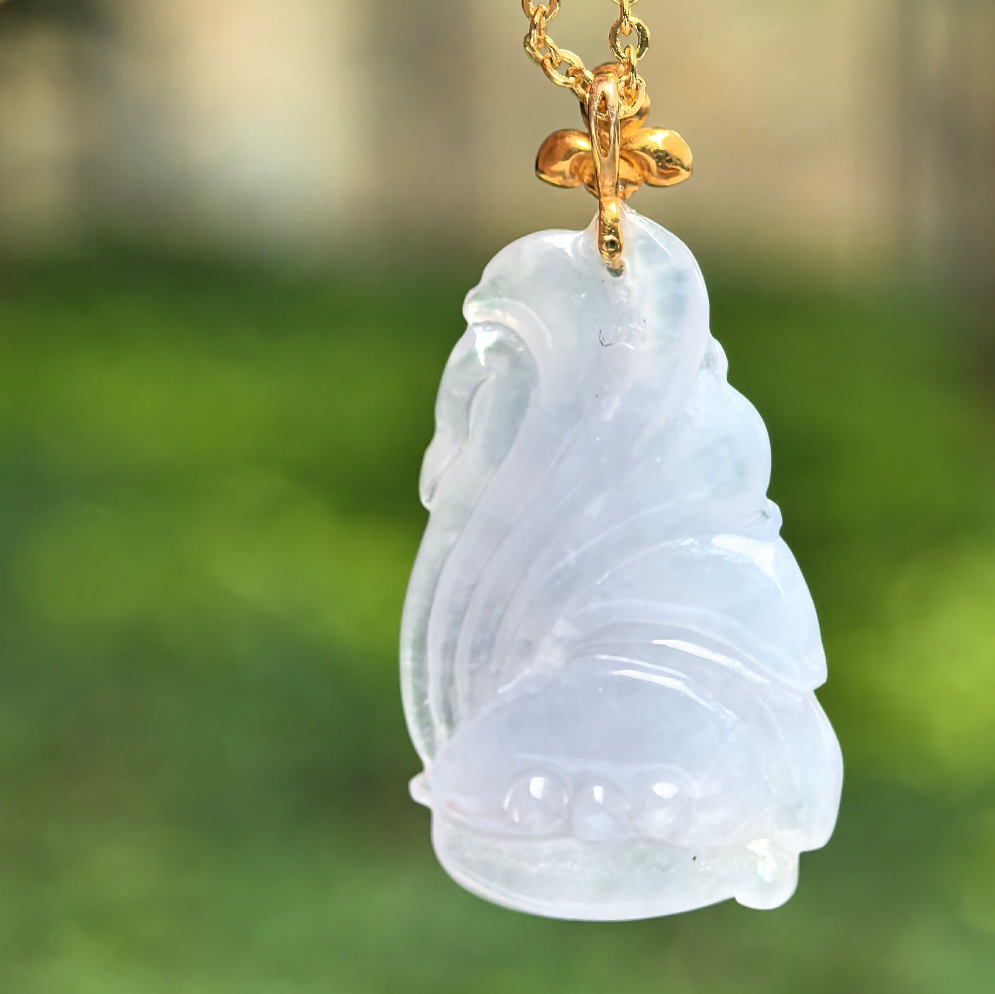 Back view of icy glutinous lavender nine-tailed fox jadeite pendant showing smooth carved details.
