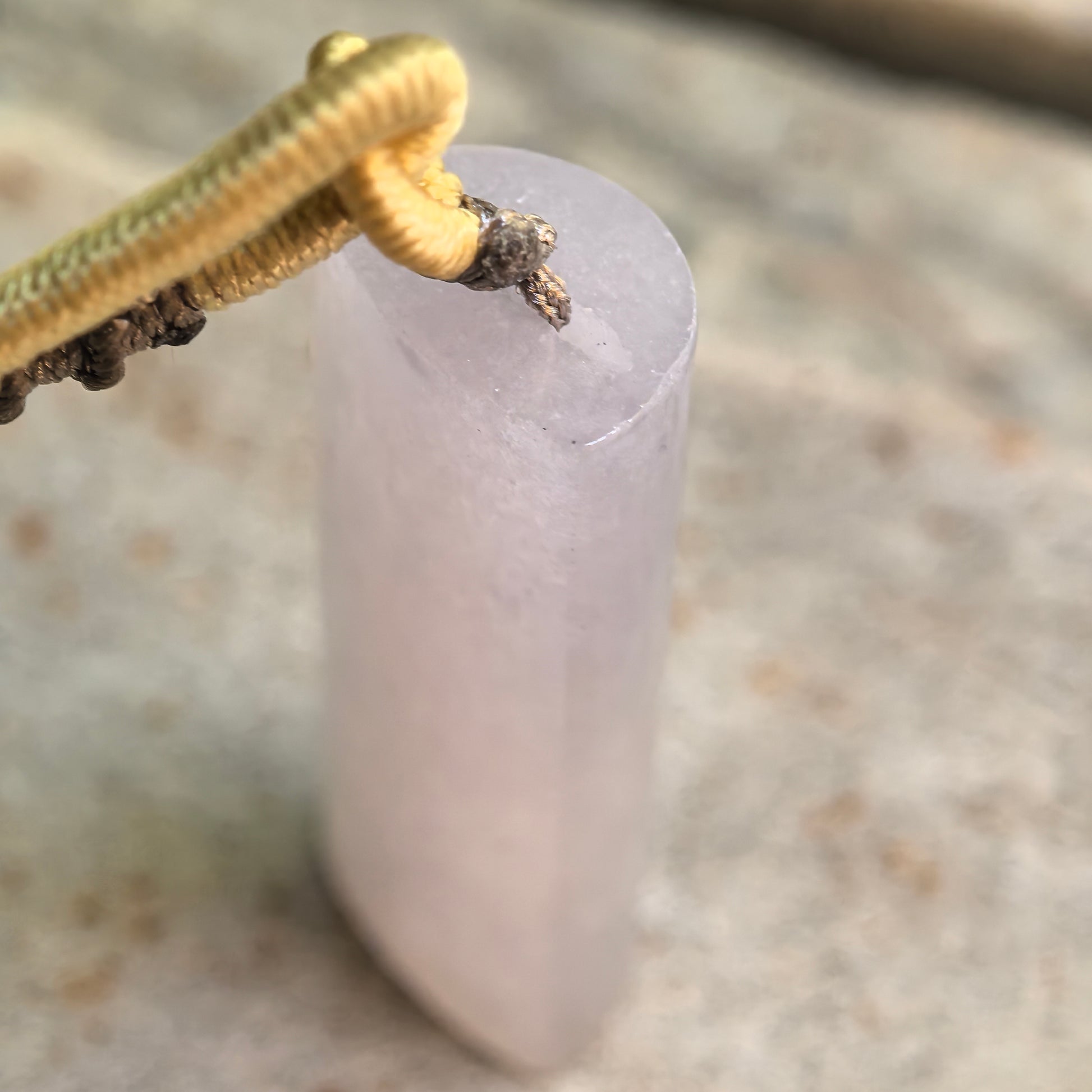 Close-up of light purple jadeite plain pillar pendant showing smooth arched rectangular surface.
