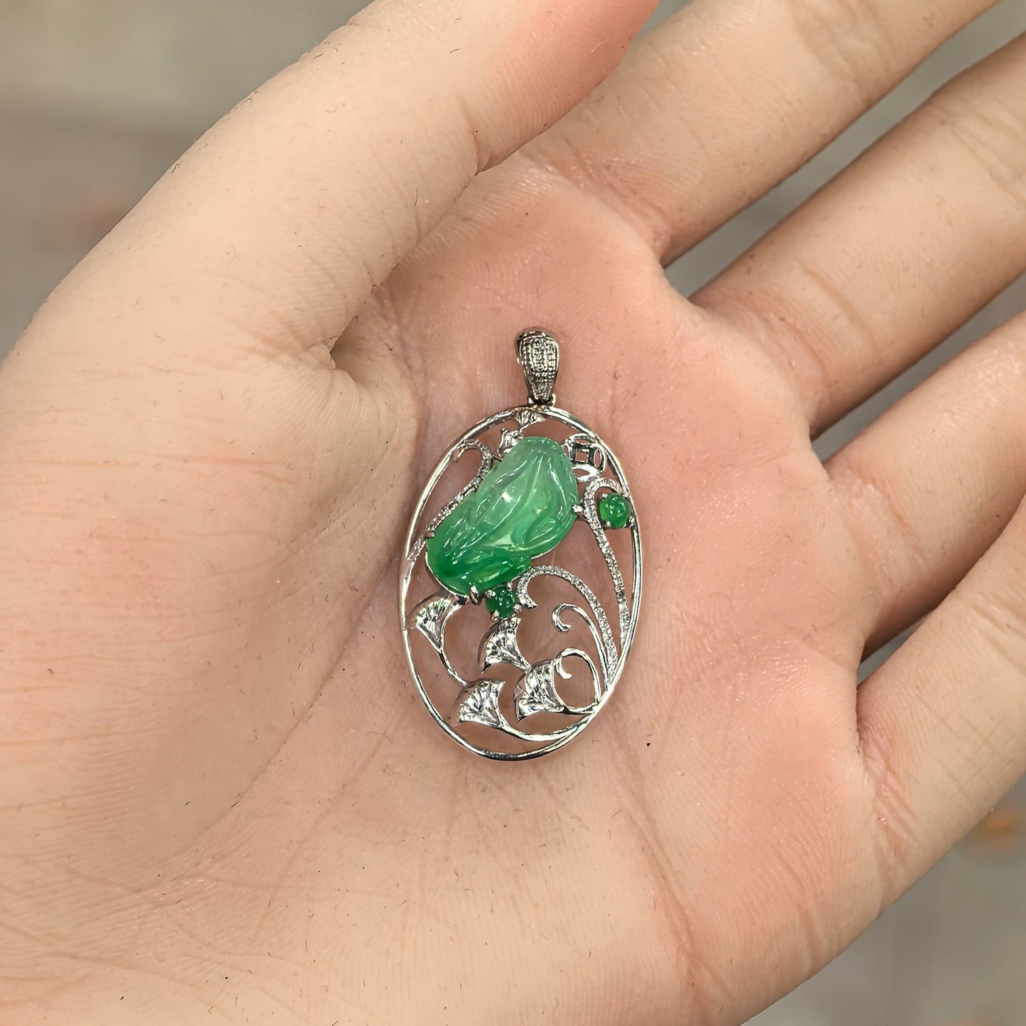 Jade Pixiu pendant worn on hand showing scale, translucency, and daily wear effect of fine jade jewelry.

