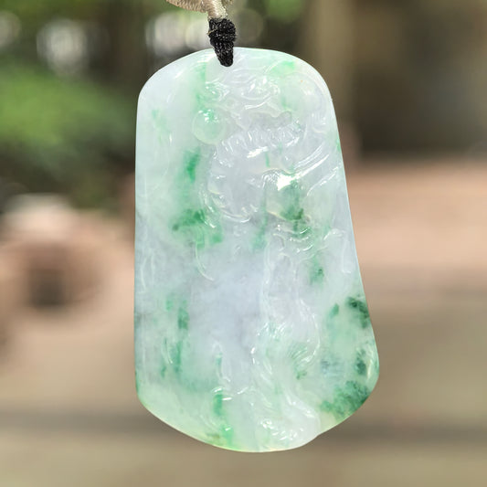 Natural Grade-A glutinous icy green floating color dragon jadeite pendant hanging on cord.