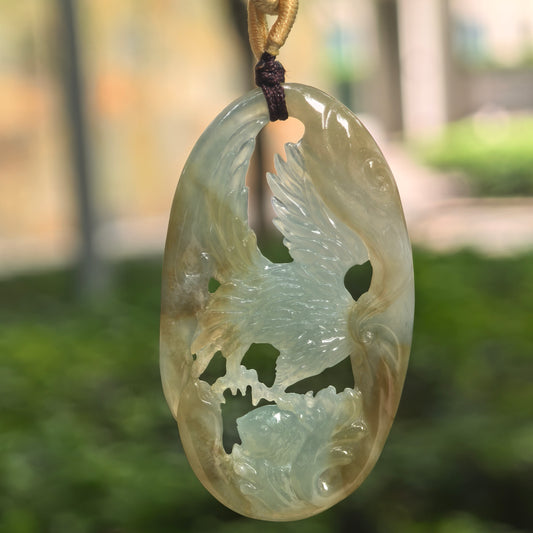 Natural Grade-A glutinous yellow and green jadeite eagle pendant hanging on cord.