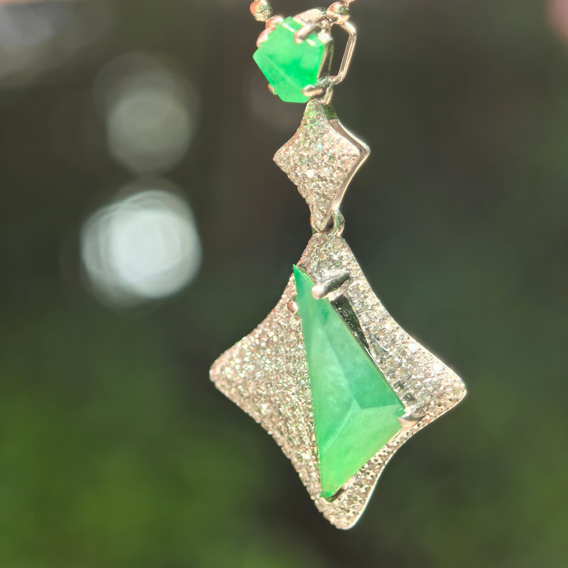 Natural Grade-A icy green jadeite rhombus pendant with 18K gold and diamond accents.
