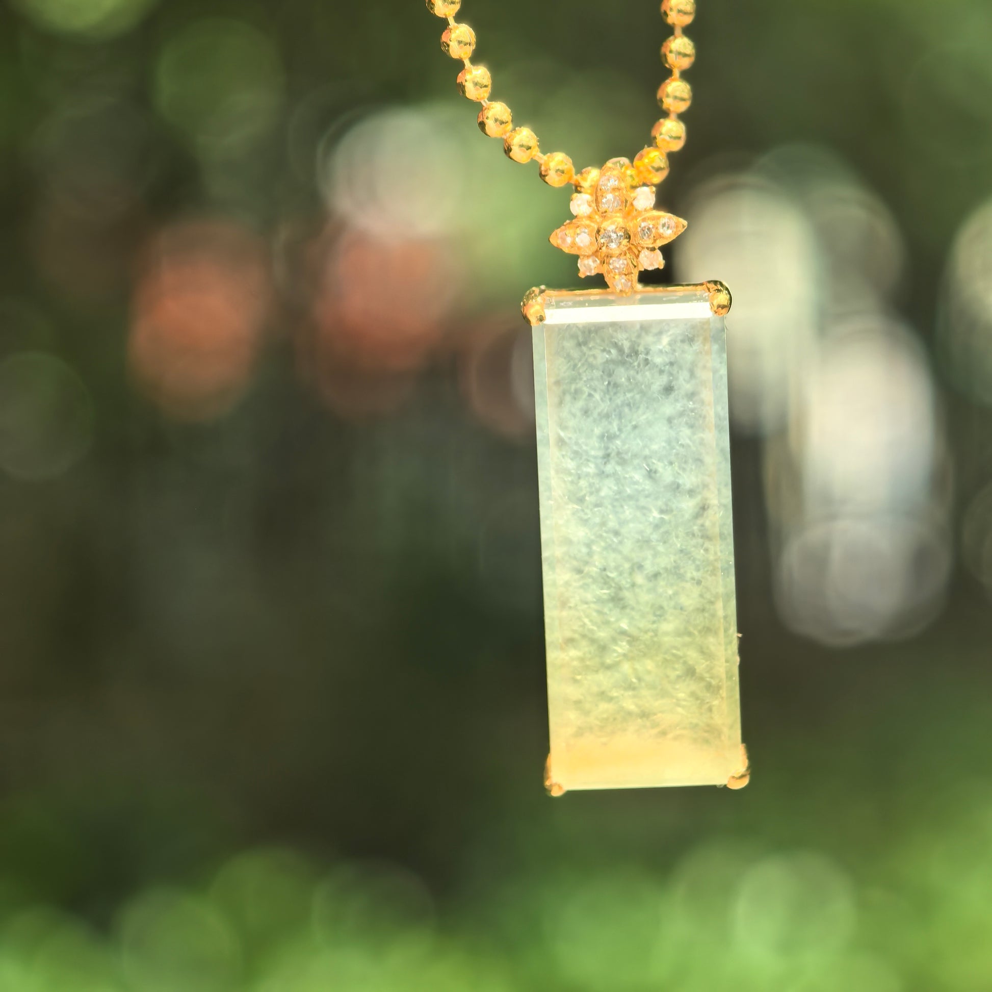 Natural Grade-A icy yellow jadeite plain plaque pendant with 18K gold and diamond accents.