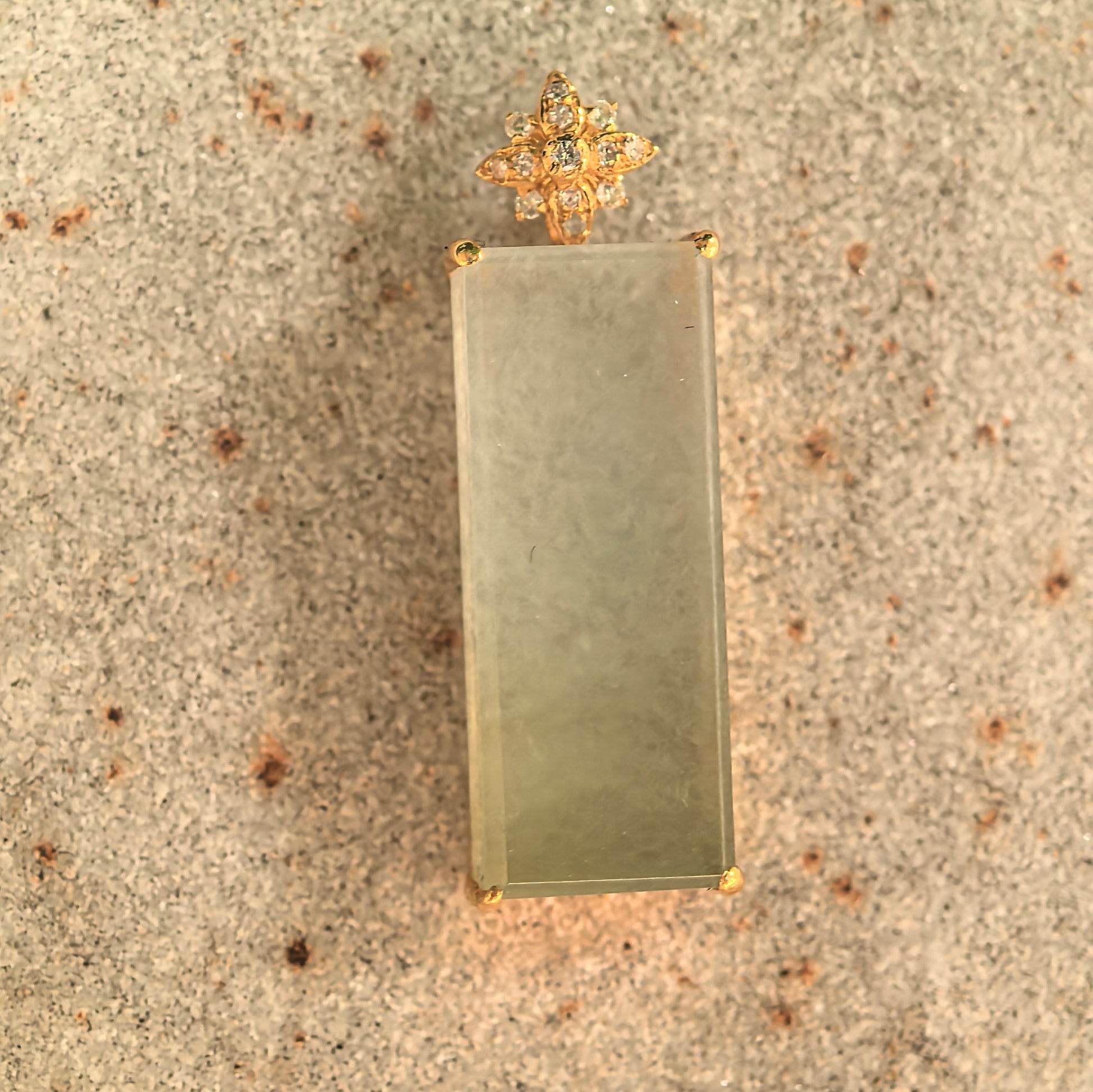 Rectangular jadeite plain plaque pendant with floral 18K gold diamond setting.
