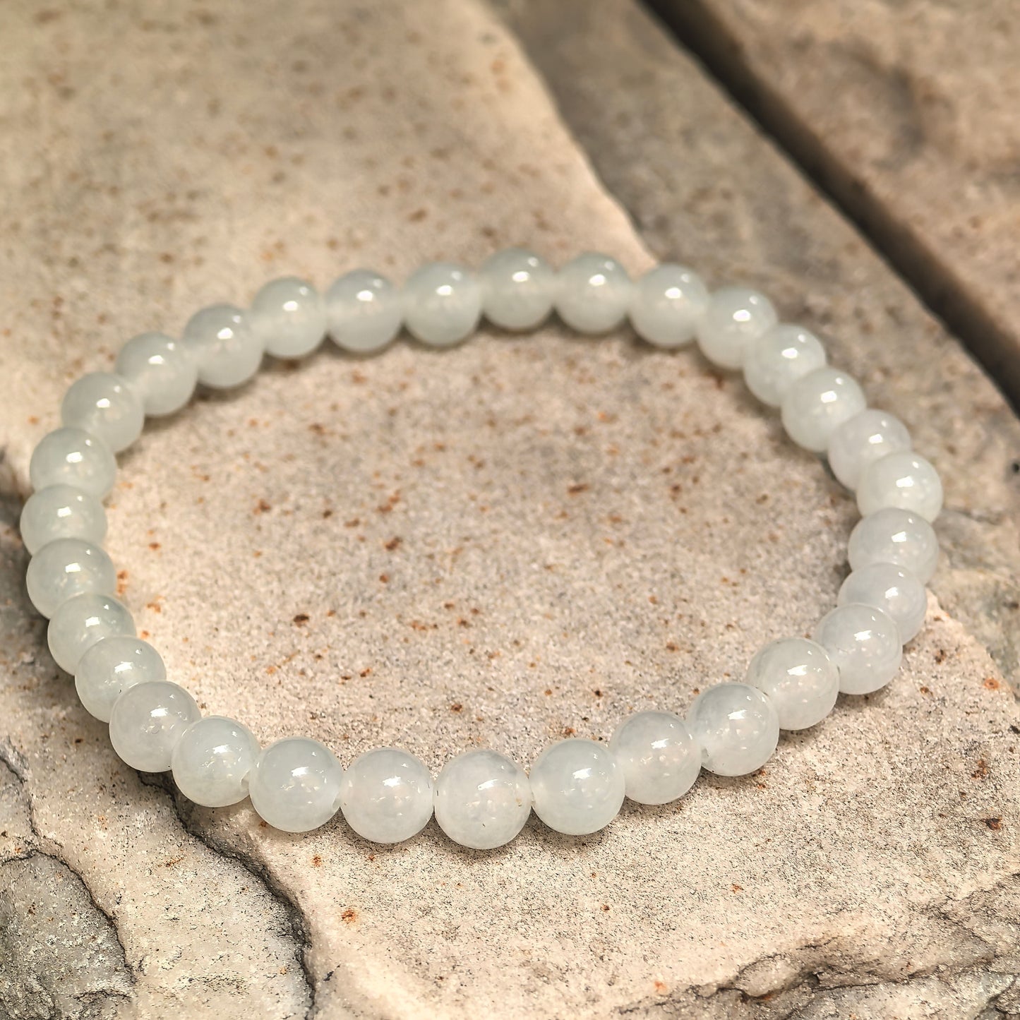 Natural Burmese jadeite beaded bracelet with polished white round beads.
