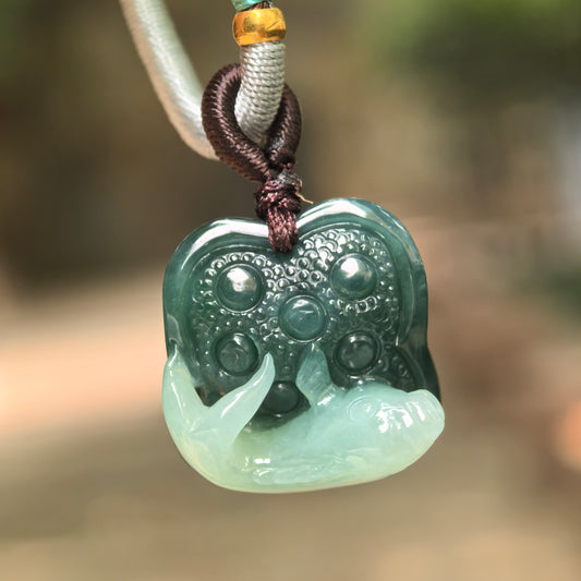 Natural Grade-A glutinous light and dark green fish lotus jadeite pendant hanging on cord.
