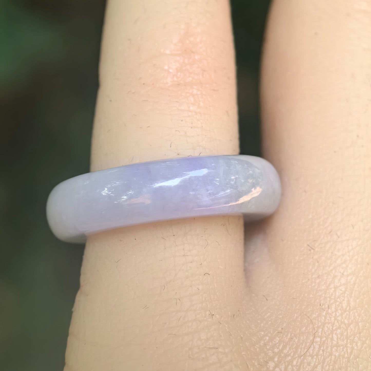Close-up of lavender jadeite ring band showing soft purple color and smooth polished luster.
