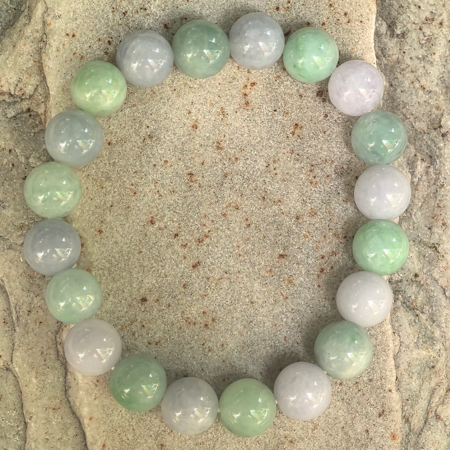 Natural Burmese jadeite bracelet with soft green and lavender round beads.
