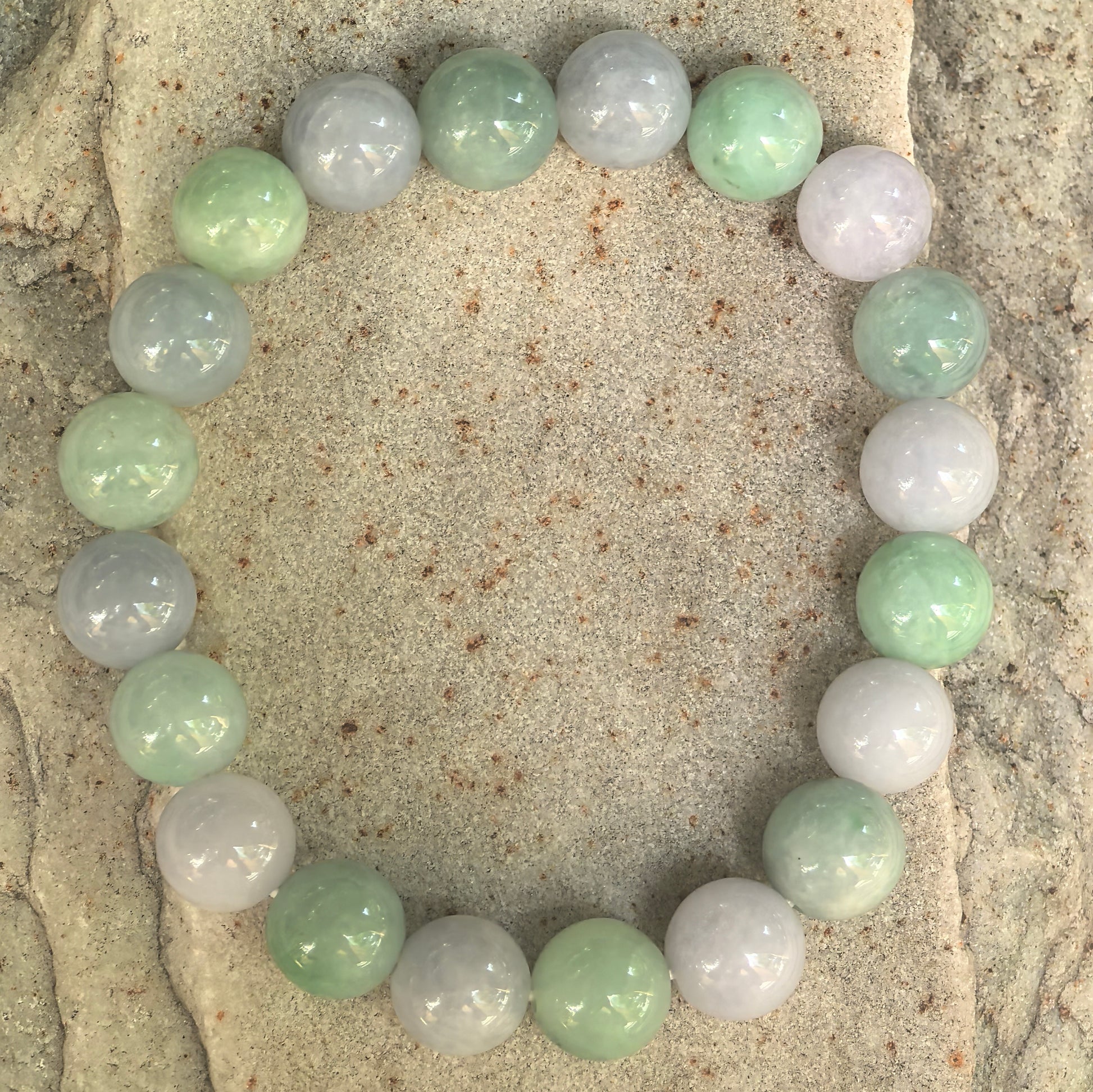 Natural Burmese jadeite bracelet with soft green and lavender round beads.
