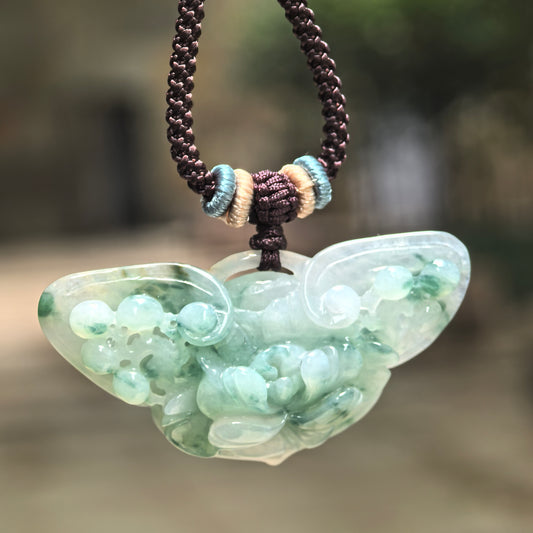 Natural Grade-A glutinous green floating flower butterfly jadeite pendant hanging on cord.
