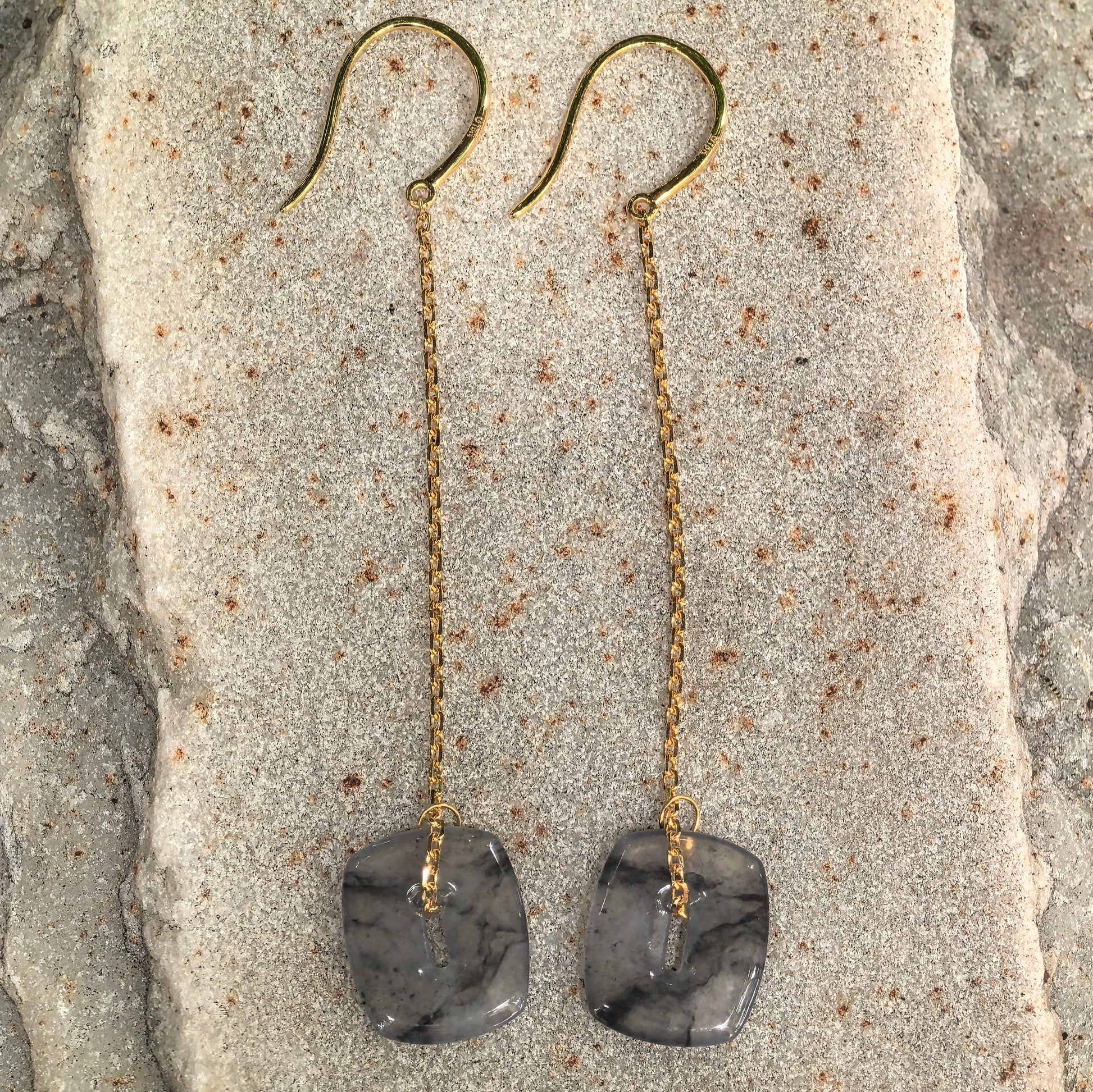 Pair of black-gray jadeite thread earrings with long 18K gold chains and square jadeite plaques.
