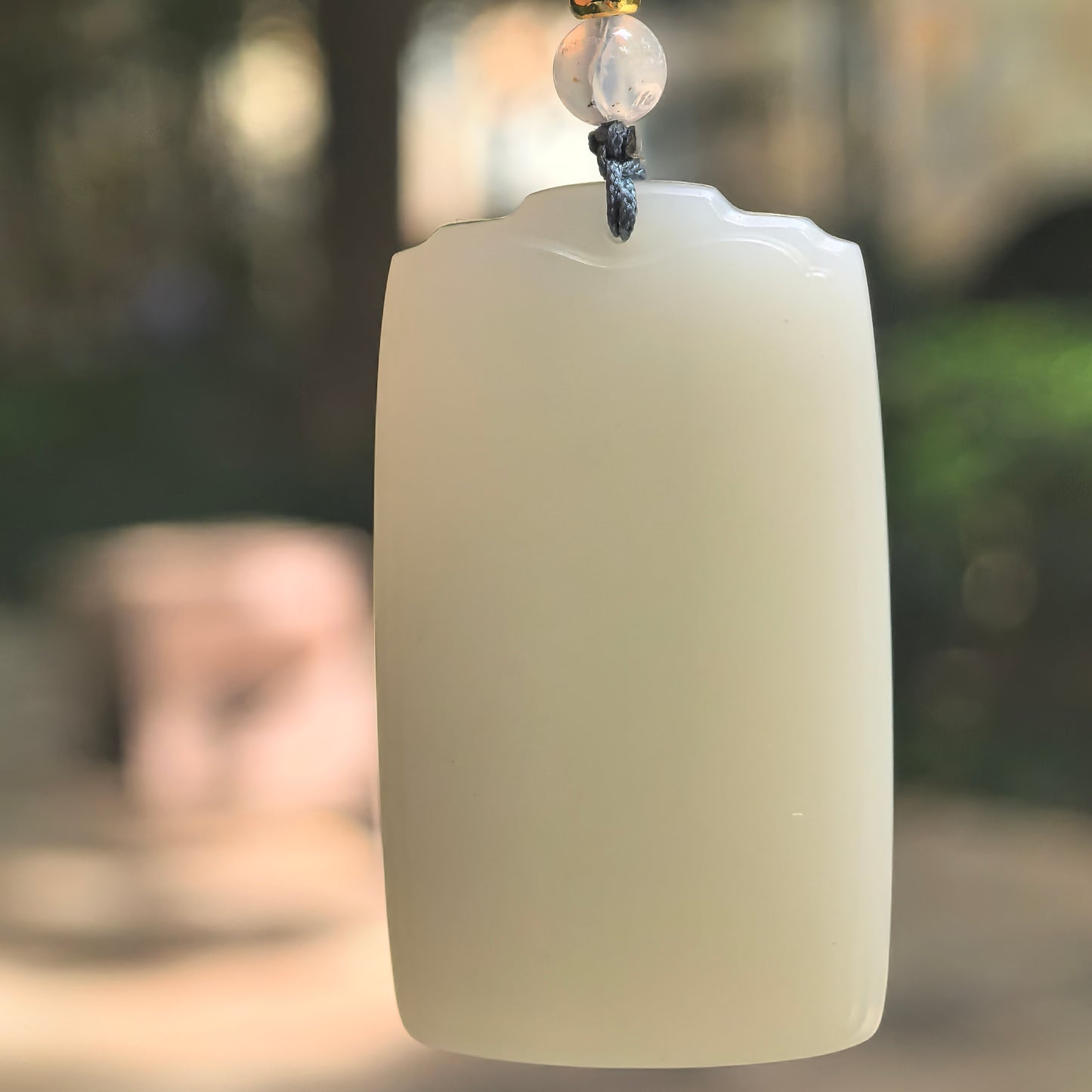 Natural Xinjiang Hetian jade blue-white plain plaque pendant hanging on cord.
