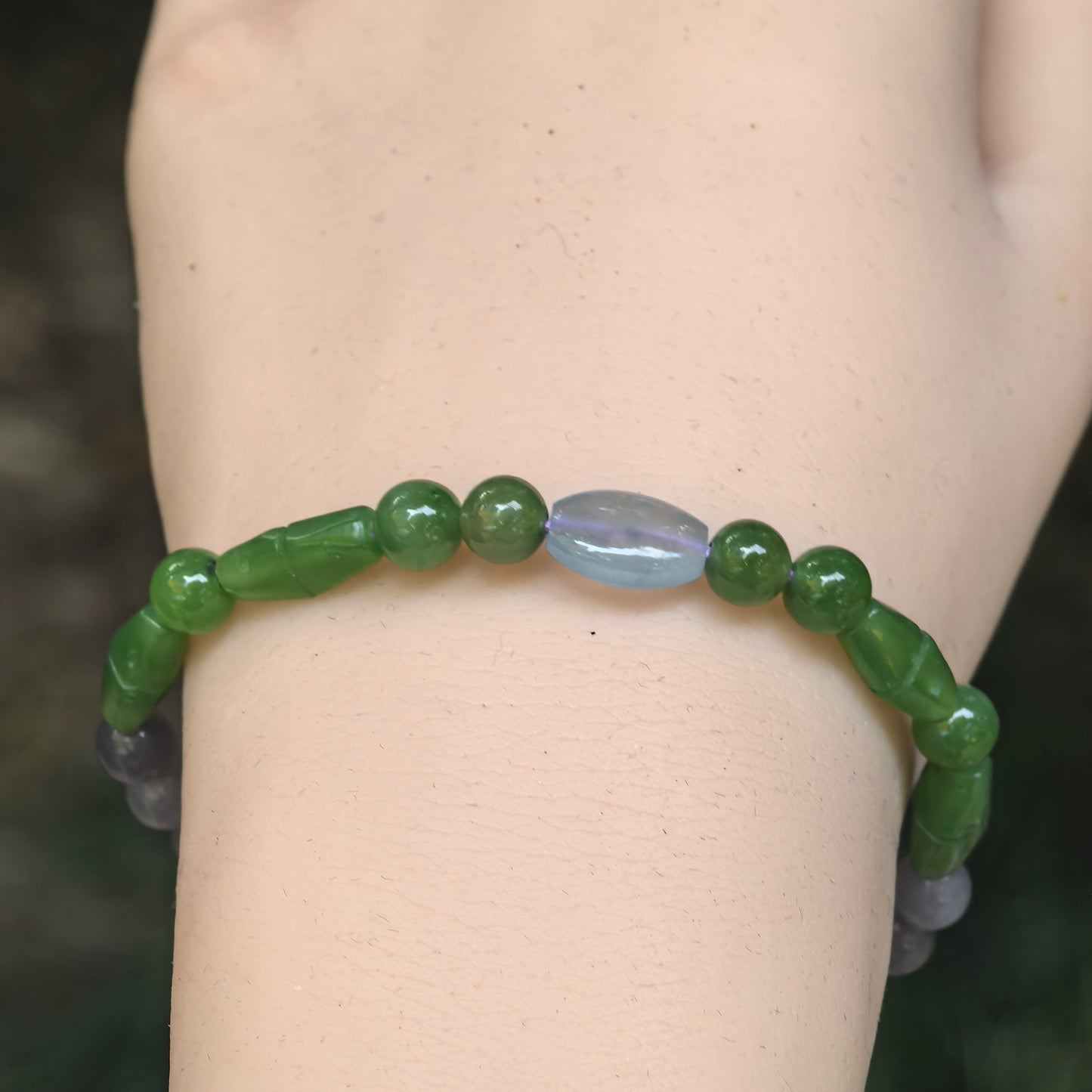 Front wearing view of the green nephrite and smoky lavender Hetian jade mixed-bead bracelet.
