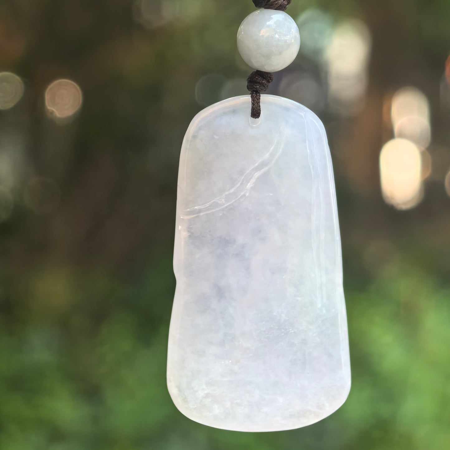 Natural Grade-A Icy Glutinous White Abstract Guanyin Jadeite Pendant · Burmese Jade
