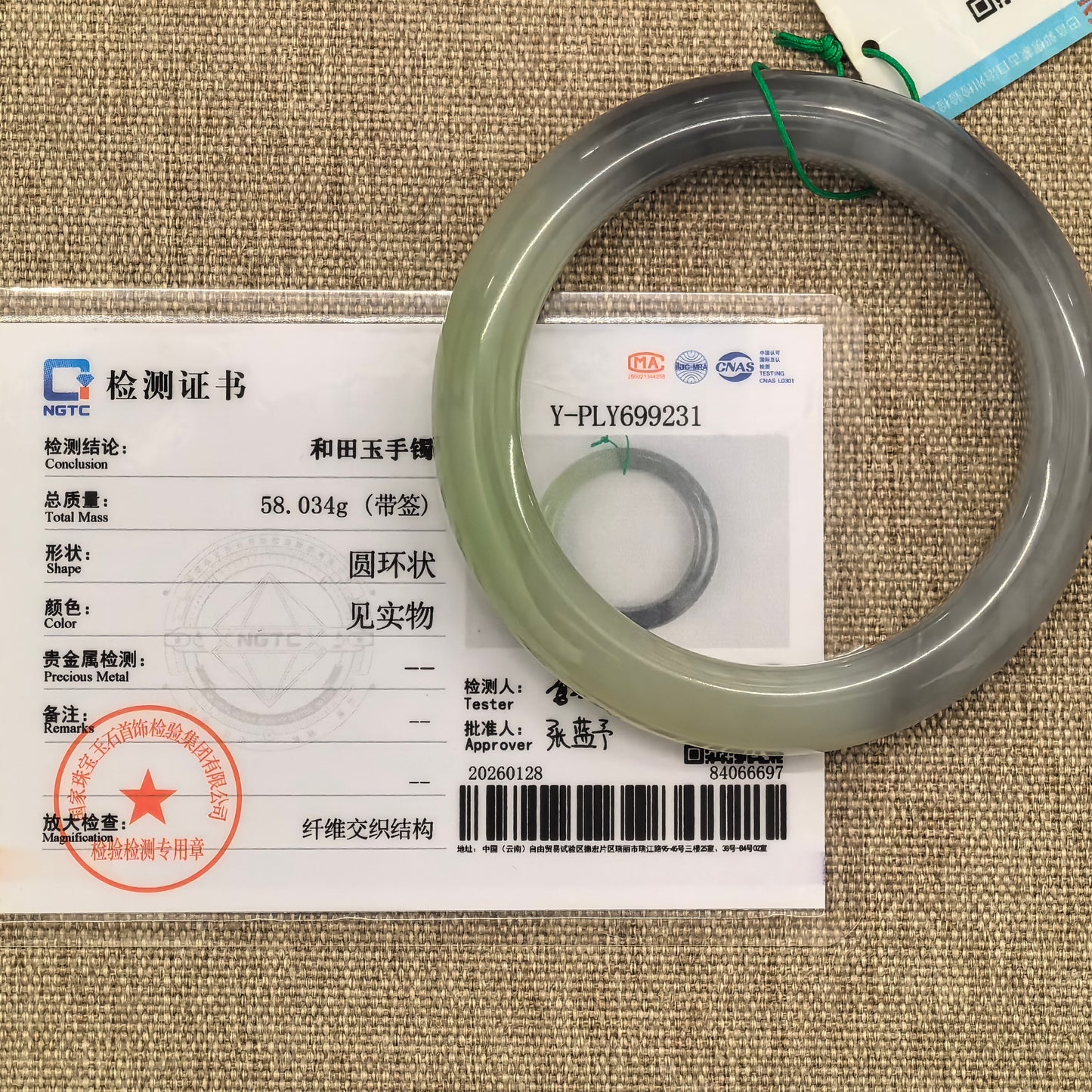 Natural smoky purple and cuiqing green Hetian jade bangle displayed with its matching NGTC certificate.