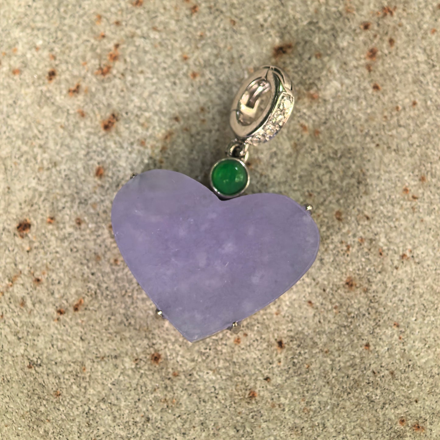 Front view of natural lavender jadeite heart pendant showing the flat polished jade surface.