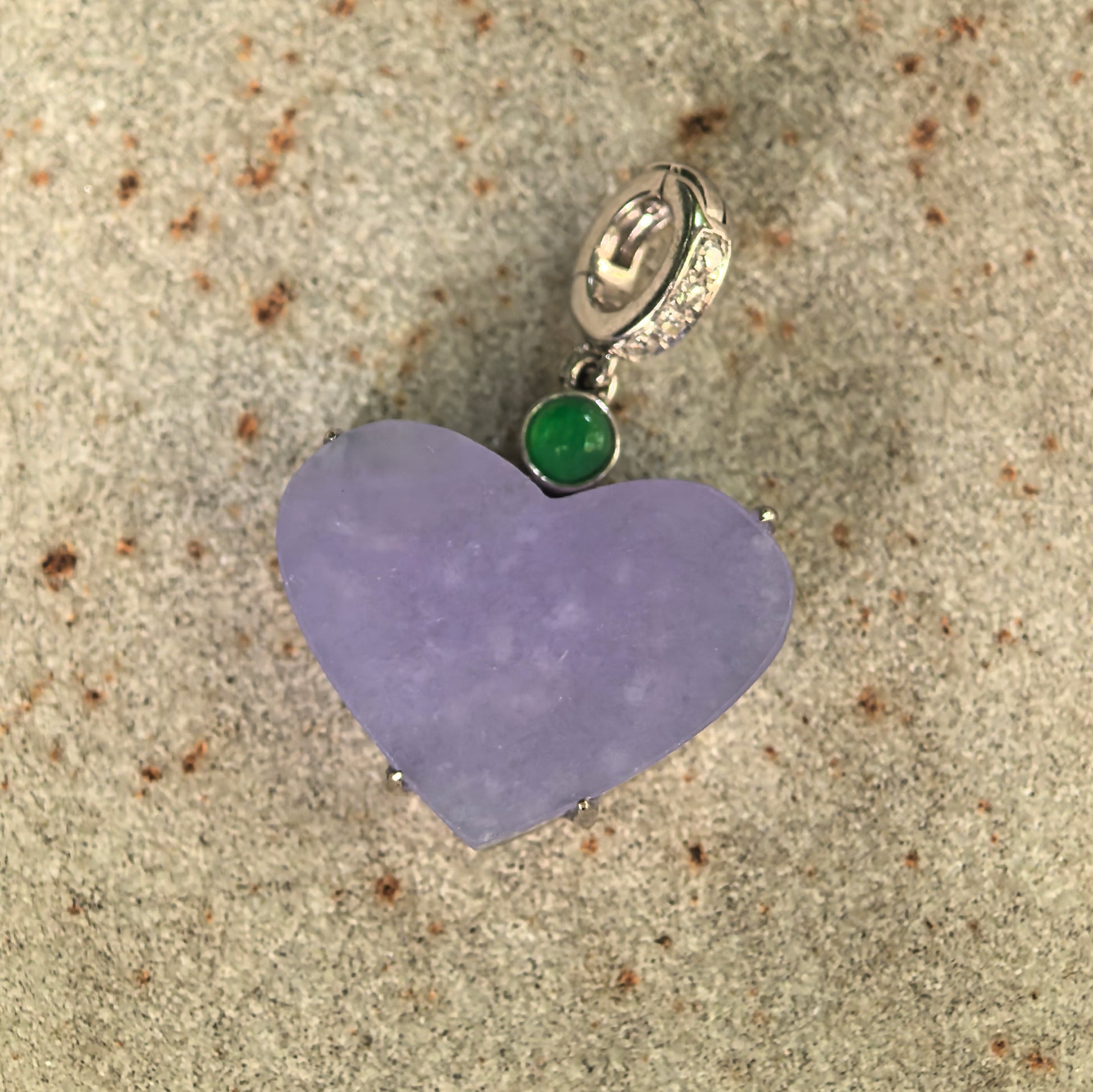 Front view of natural lavender jadeite heart pendant showing the flat polished jade surface.