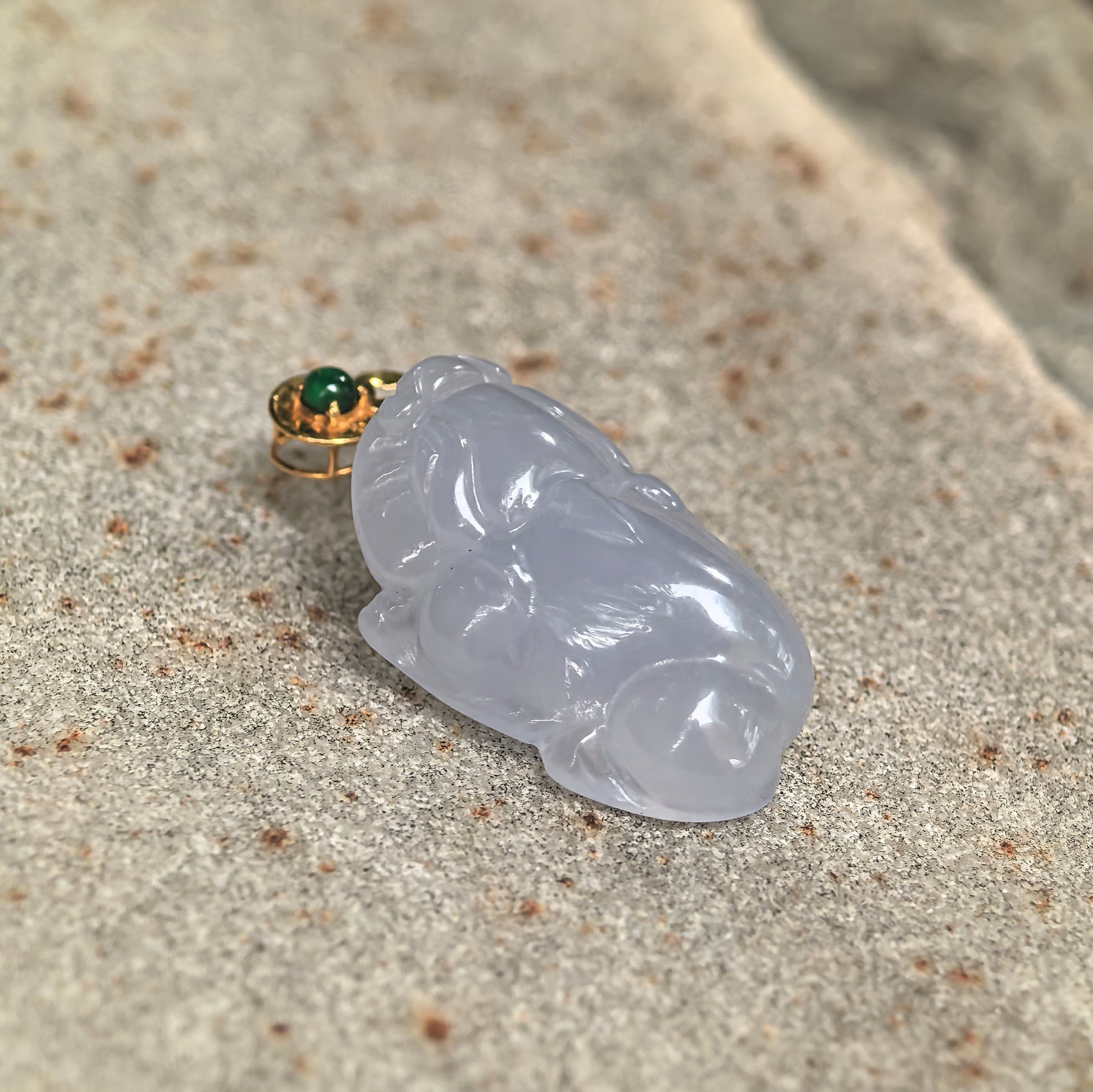 Close-up of icy glutinous lavender Money Toad jadeite pendant showing detailed carving, smooth polish, and natural translucency.
