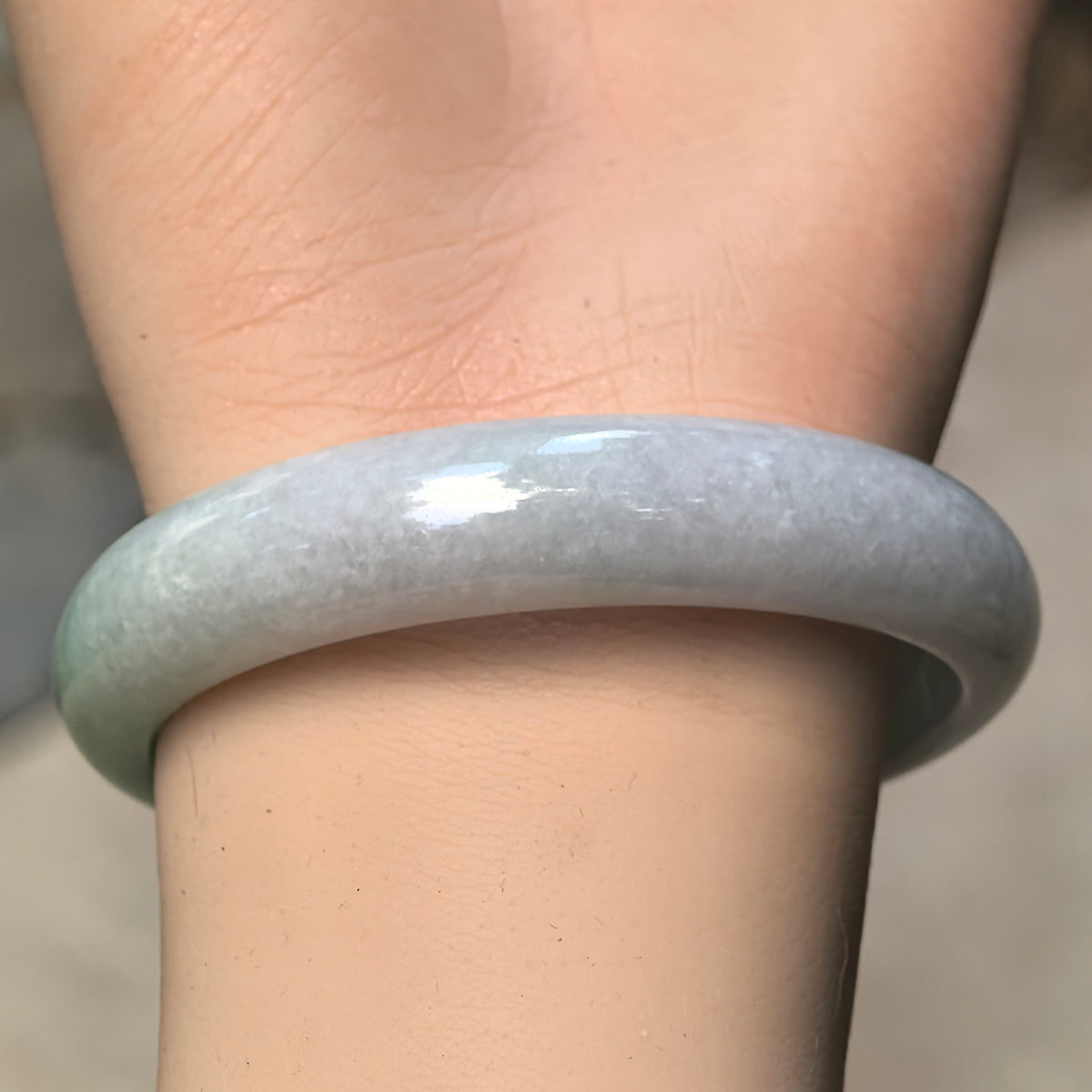 Glutinous White-Base Green Oval Jadeite Bangle – 53mm