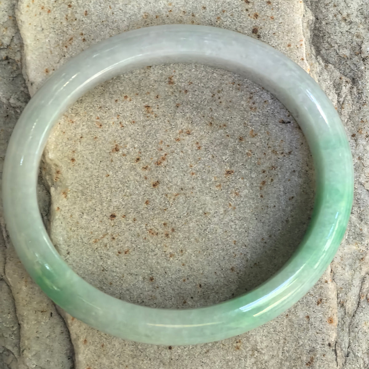 Glutinous White-Base Green Oval Jadeite Bangle – 53mm