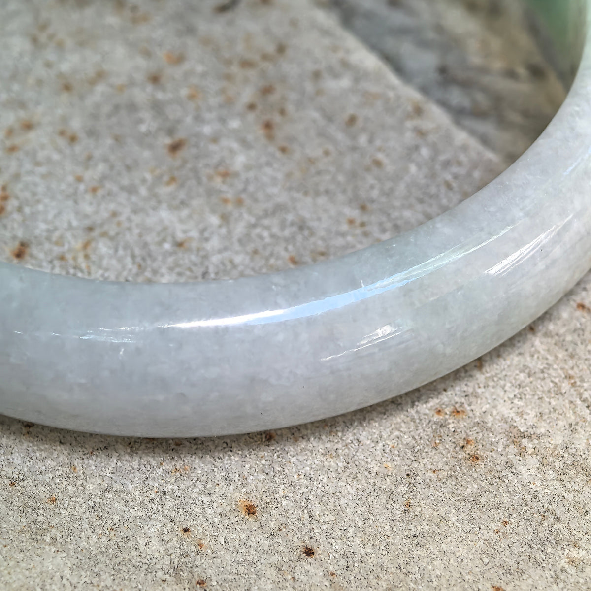 Glutinous White-Base Green Oval Jadeite Bangle – 53mm
